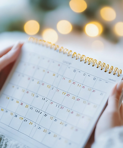 rosenoirtattoo_person_holding_a_calendar_close-up_on_the_calend_7efde256-6bb1-495d-a550-01