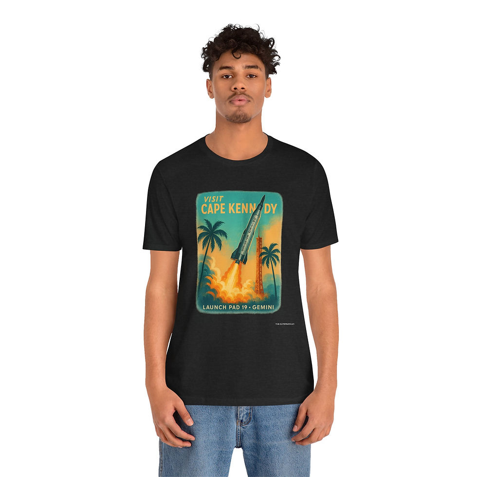 Thumbnail: Model wearing Visit Cape Kennedy tropical rocket tee by The OuterMoo – retro Florida Space Coast look.