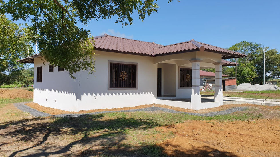 a white house with a brown tile roof