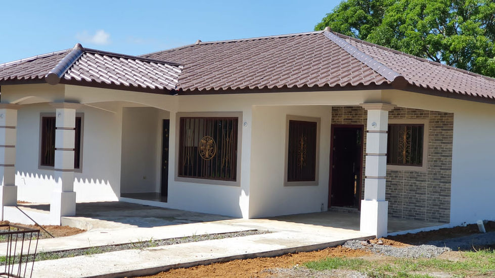 a white house with a brown tile roof