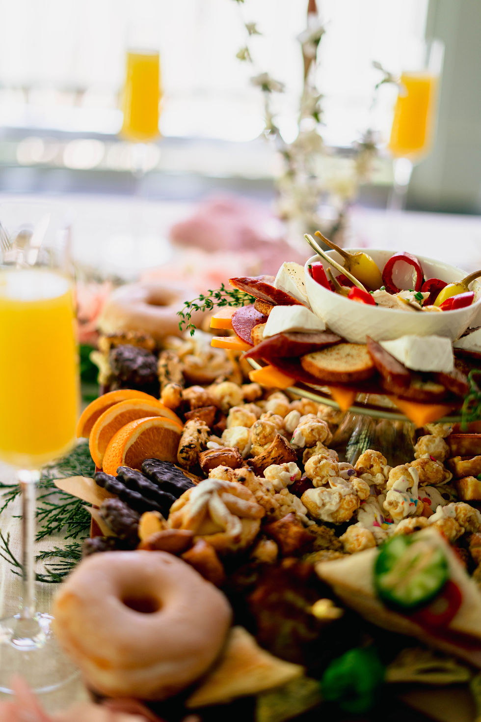 Eye-level view of a stylish picnic setup with elegant tableware and fresh flowers