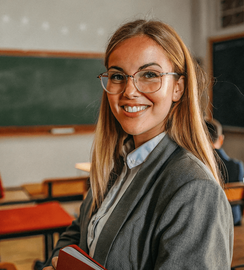 smiling--young--blonde-teacher-with-blue-eyes--in- (1).png