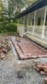 Commercial landscaping contractor installing brick patio.