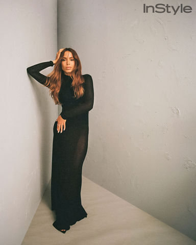 Digital image retouching for Anitta editorial. Full-body portrait in black dress with focus on elegance and lighting.