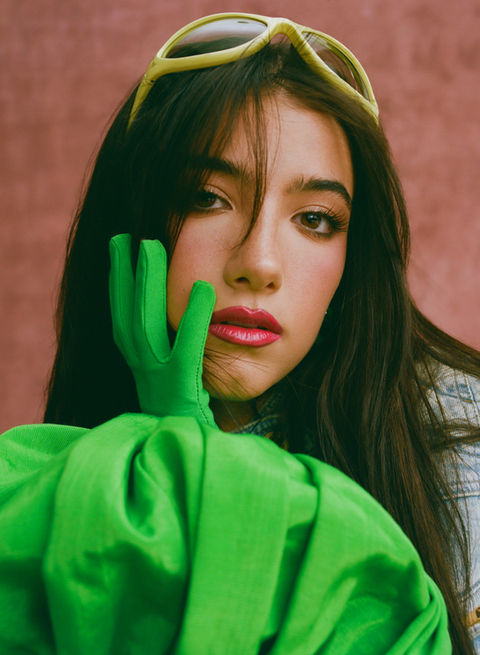 Commercial portrait retouching for Spotify D'Amelio ad. Color correction and details on a solid background.