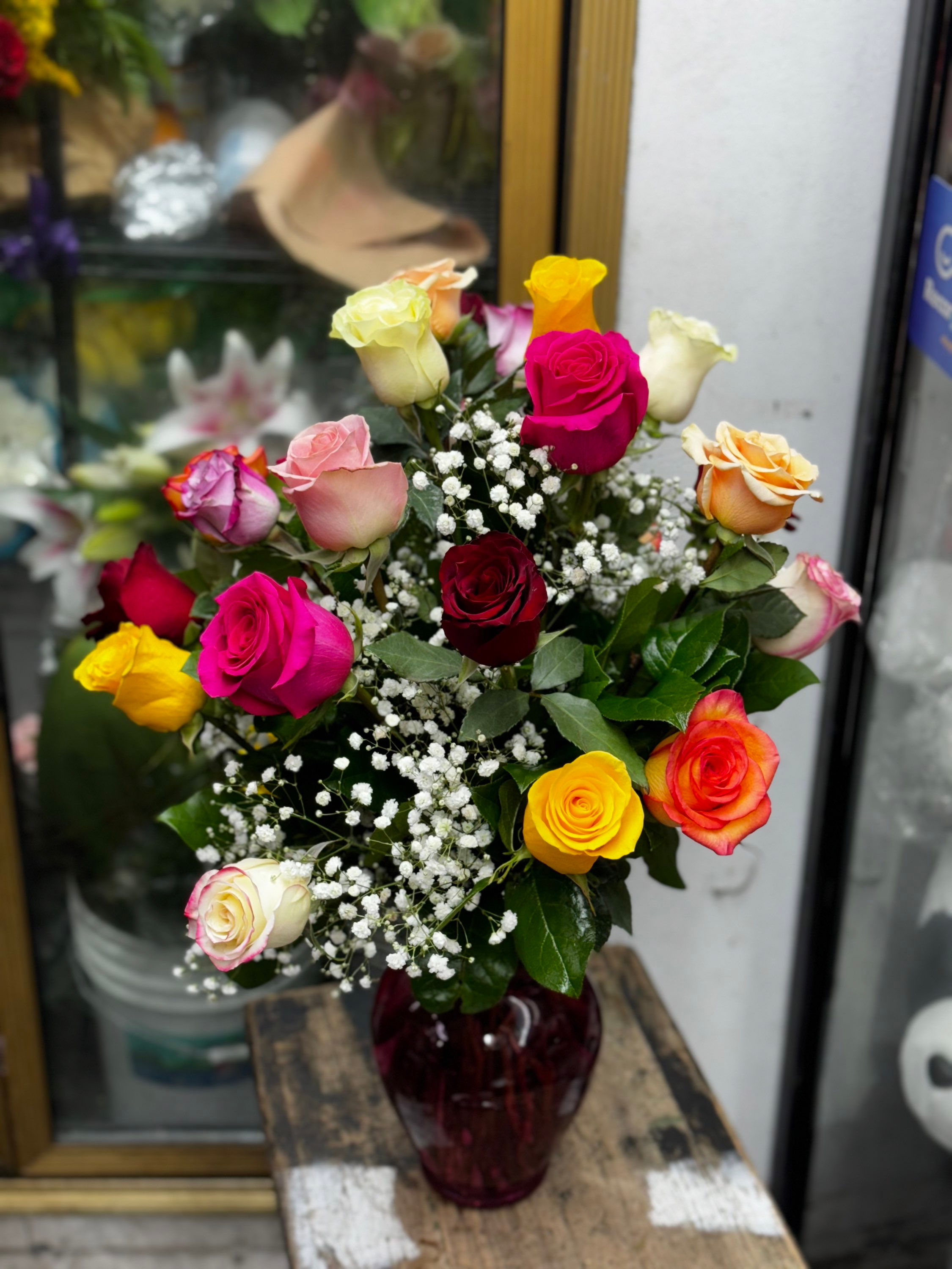 25 Beautiful Rainbow of Roses in a Glass vase