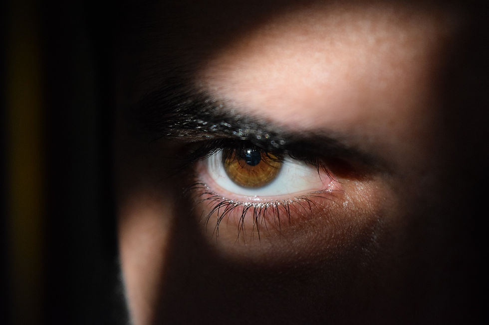 hybrid work and data security risk - picture of sinister eye in the dark