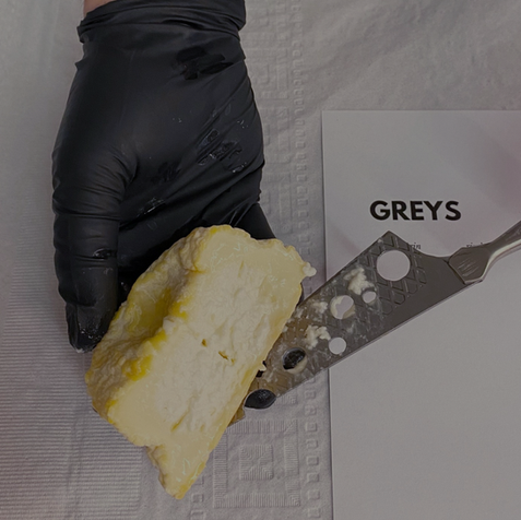 hand with cheese