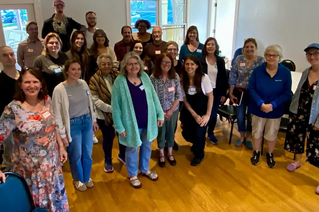 Smiling gathering of writers at PVWW's in-person writing retreat in Northampton MA