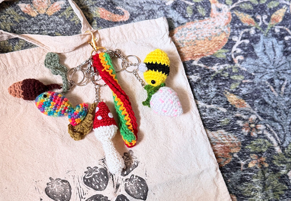 Crochet Keychains attached to a Canvas bag with decorative rug in background