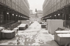 A vacant shopping plaza in Pittsburgh, mid-winter, covered in snow.
