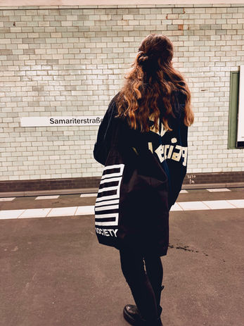 Model wearing 0815 SOCIETY Bag at Friedrichshain Subway Station
