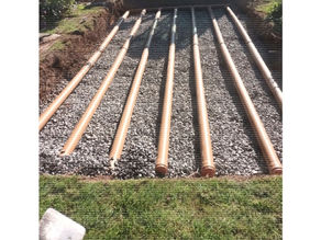 soakaway pipes sitting over gravel
