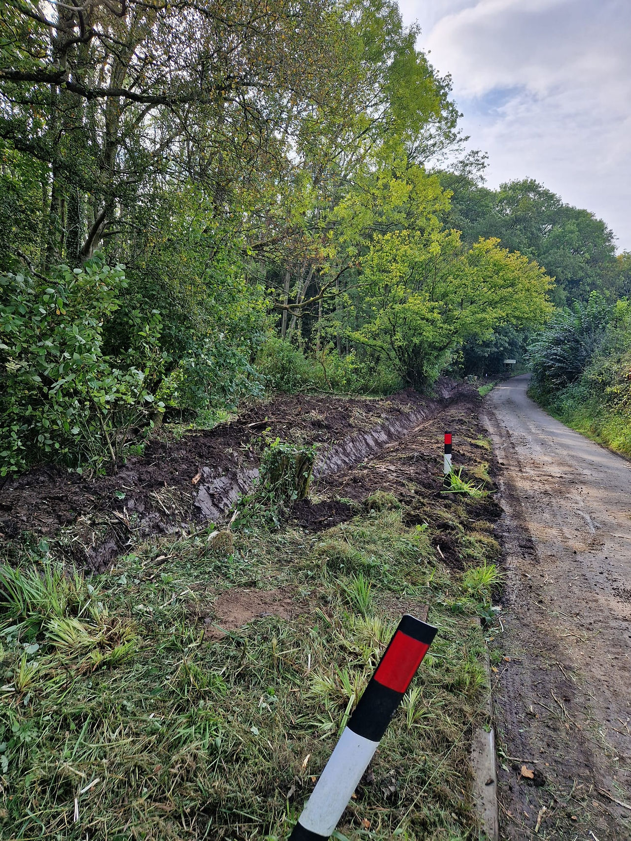 Precision edging work providing a clean finish to a road verge for Staffordshire Wildlife Trust