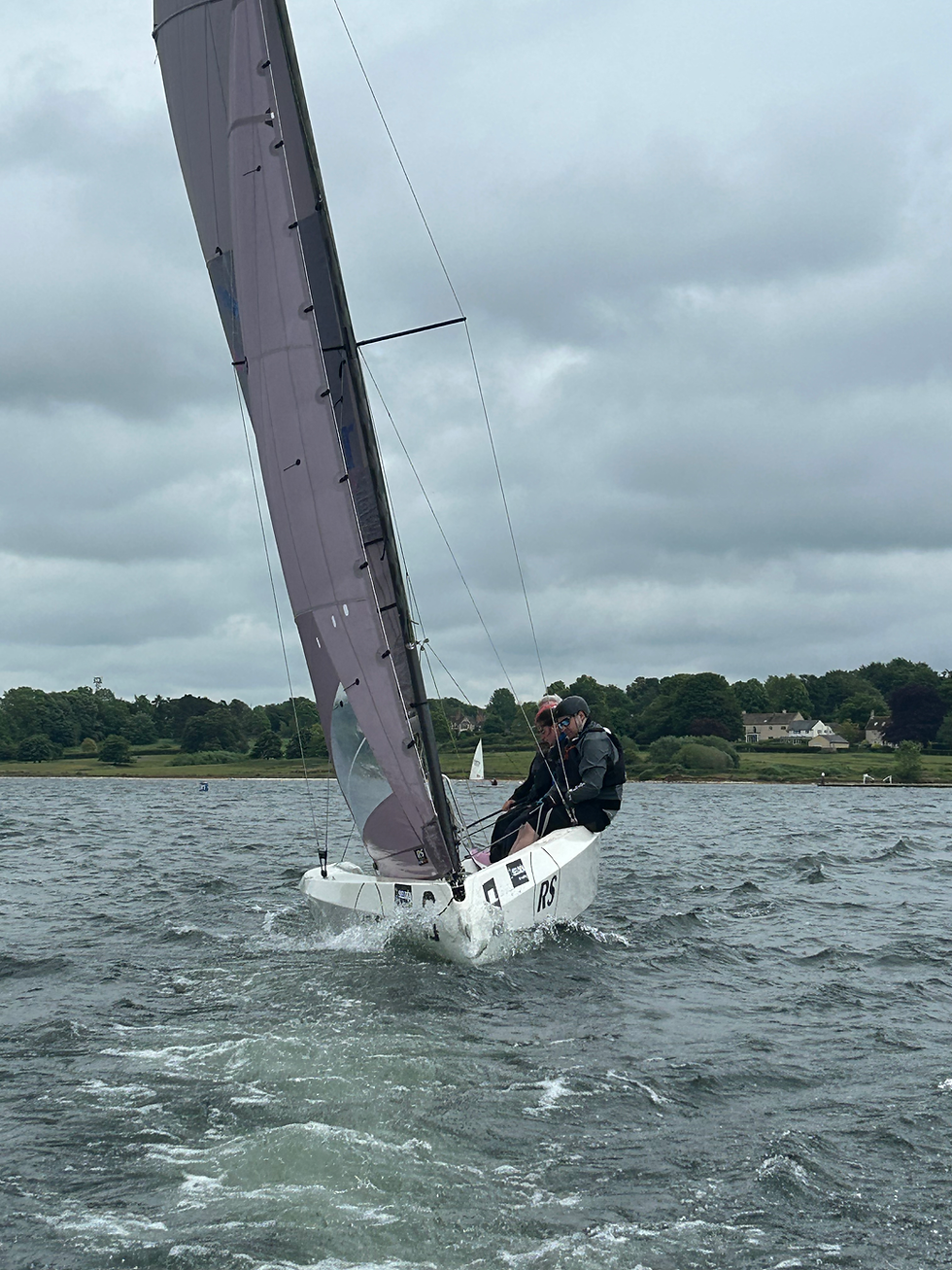 RS21 sailing upwind dark skys. Karl, Kate, Ian and Sarah