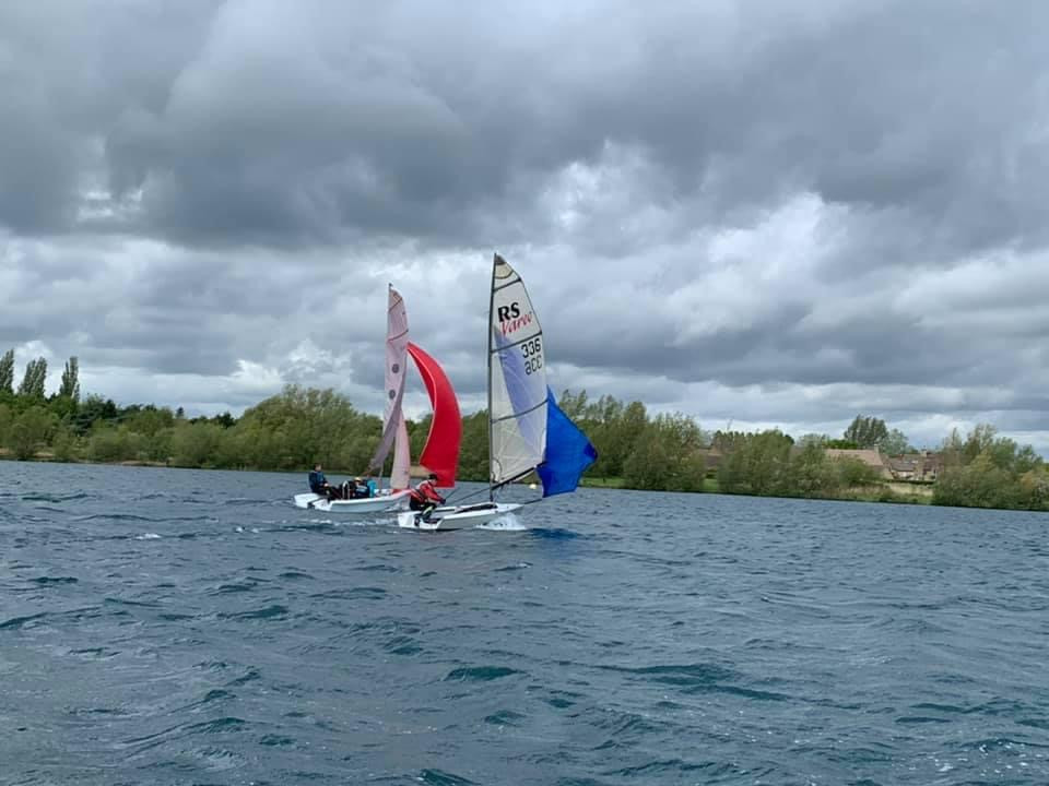 Down wind, Judith, Dennis and Burt flying a red kite.