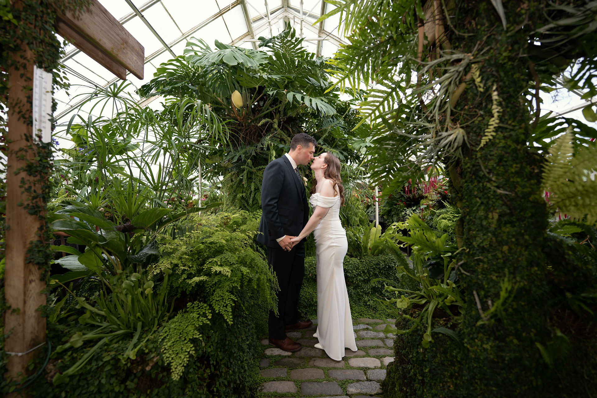 Couple kissing at Volunteer Park Conservatory in Seattle
