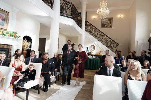Guests watch couple walking down aisle at elegant White Salmon WA wedding.
