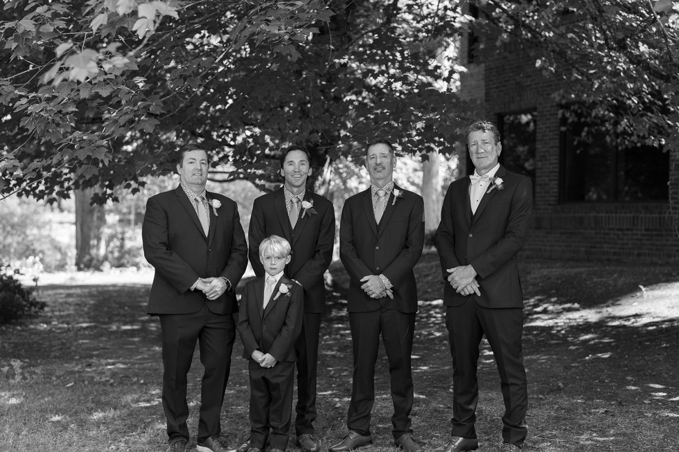 Five men and boy in suits, elegant summer wedding at The Foundry.
