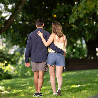 Couple walks hand-in-hand, Green Lake proposal