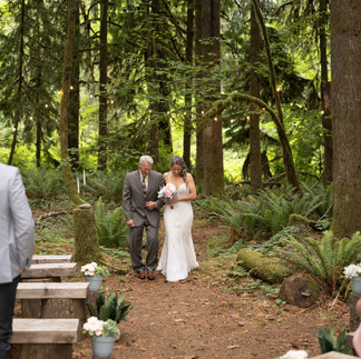 Bride and her father walking down the aisle at Forest Creek Darrington WA.
