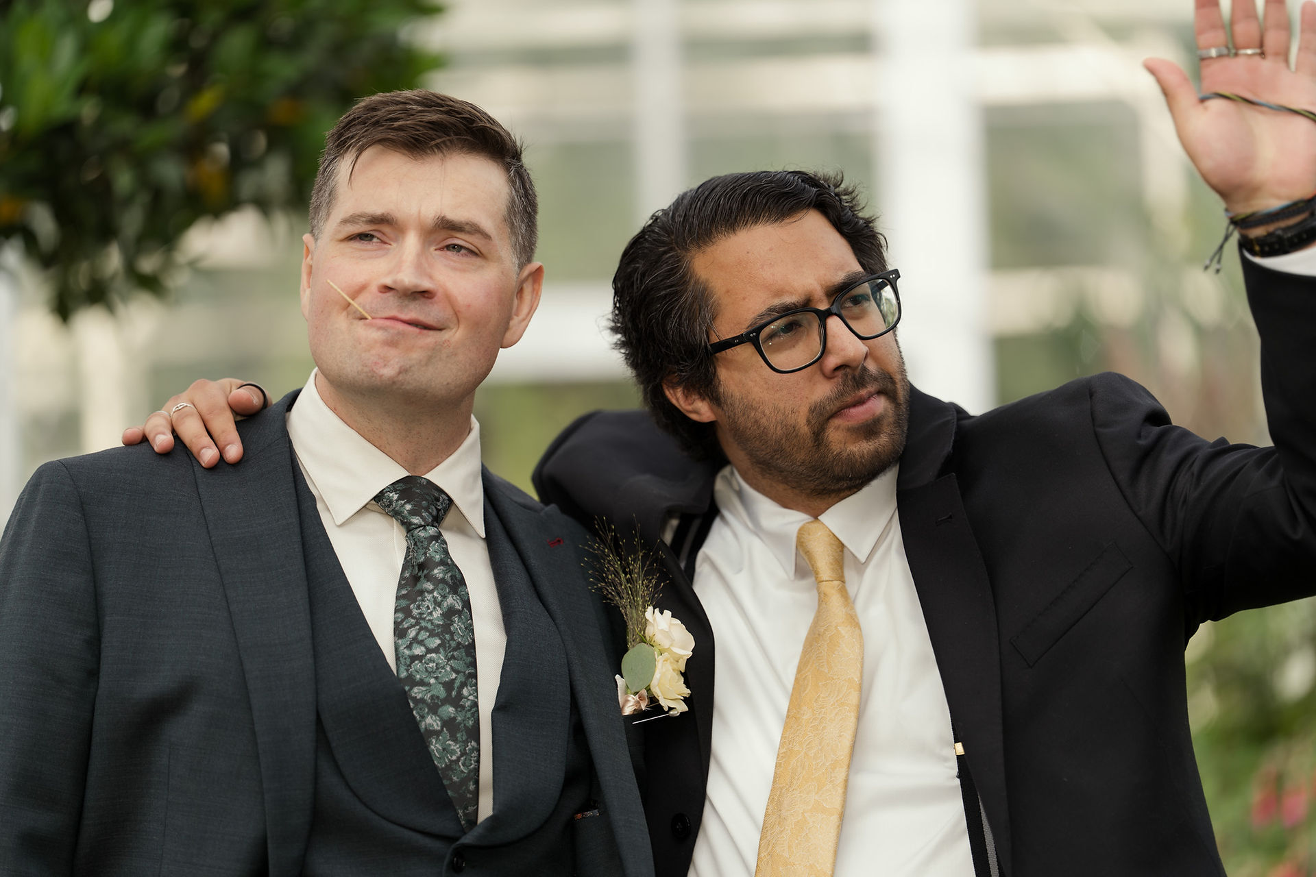 Grooms at Volunteer Park Conservatory in Seattle wedding attire.