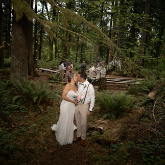 Newlyweds kissing at Forest Creek Darrington WA wedding.