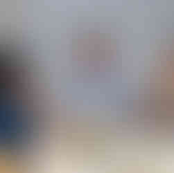 Three people enjoy a conversation at a table