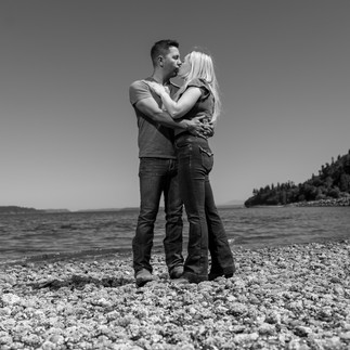 Jessica & Brian embrace on a beach