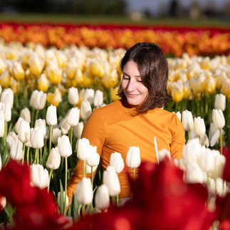 Smiling woman in tulip field, Skagit Tulip Festival