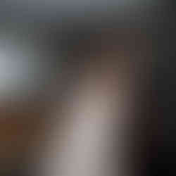 Emotional father hugs his daughter, the bride, in her wedding dress.