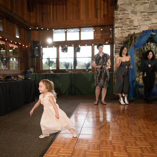 Child playing on dance floor at a Gold Mountain Golf Club wedding