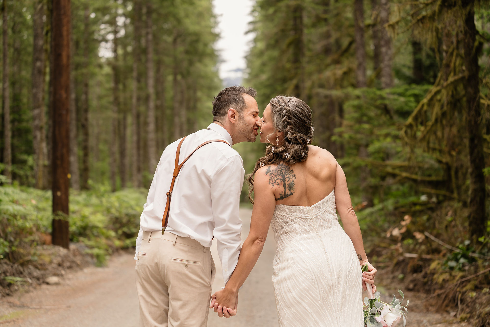 Couple kissing on a forest road at Forest Creek Darrington WA