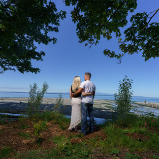 Couple embracing, ocean view