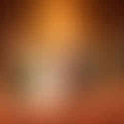 Couple exchanging vows with officiant in grand chapel ceremony.