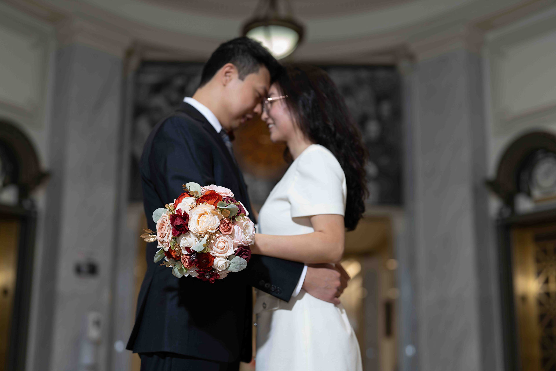 Happy couple embraces at Seattle Courthouse wedding