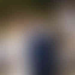 Smiling bride and groom posing at their intimate outdoor farm wedding.