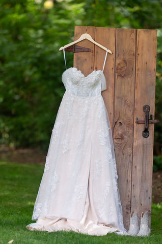 Lace wedding dress on wooden door