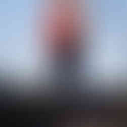 Couple embracing under a clear sky