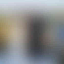 Couple exchanging rings during their outdoor ceremony with arch. Intimate Farm Wedding.