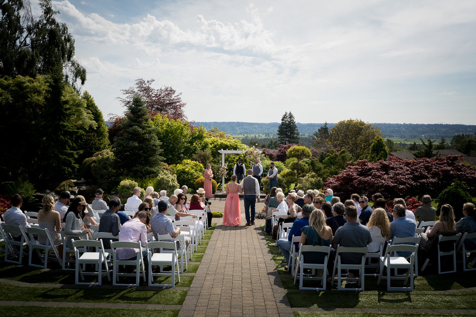 Guests attending an outdoor wedding ceremony at Olympic View Wedding Estates.