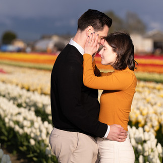 Engaged couple embracing at Skagit Tulip Festival