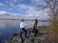 Elegant bride and groom exchanging vows in a scenic outdoor wedding captured by Seattle wedding photographer, PhotoYari.