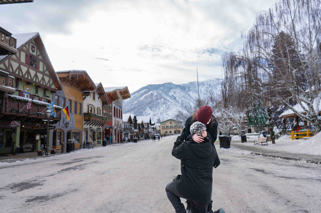 Romantic couple embraces during snowy proposal in Telluride