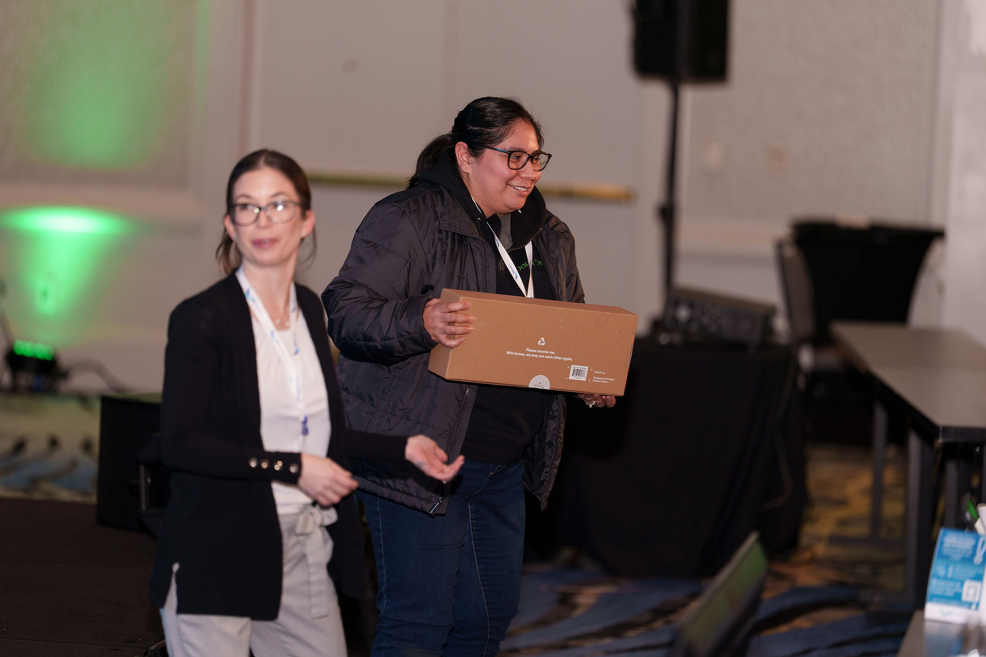Woman holding prize at symposium, Seattle Event Photography
