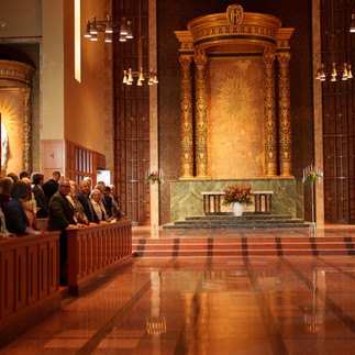 Grand Bastyr Chapel interior with guests seated for wedding ceremony.