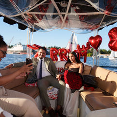 Couple's boat proposal, "Marry Me" sign, Seattle
