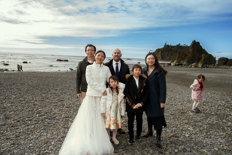 Family group on a rocky beach during an Olympic National Park elopement.