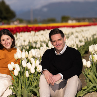 Engagement photo of couple in white tulips, Skagit Tulip Festival