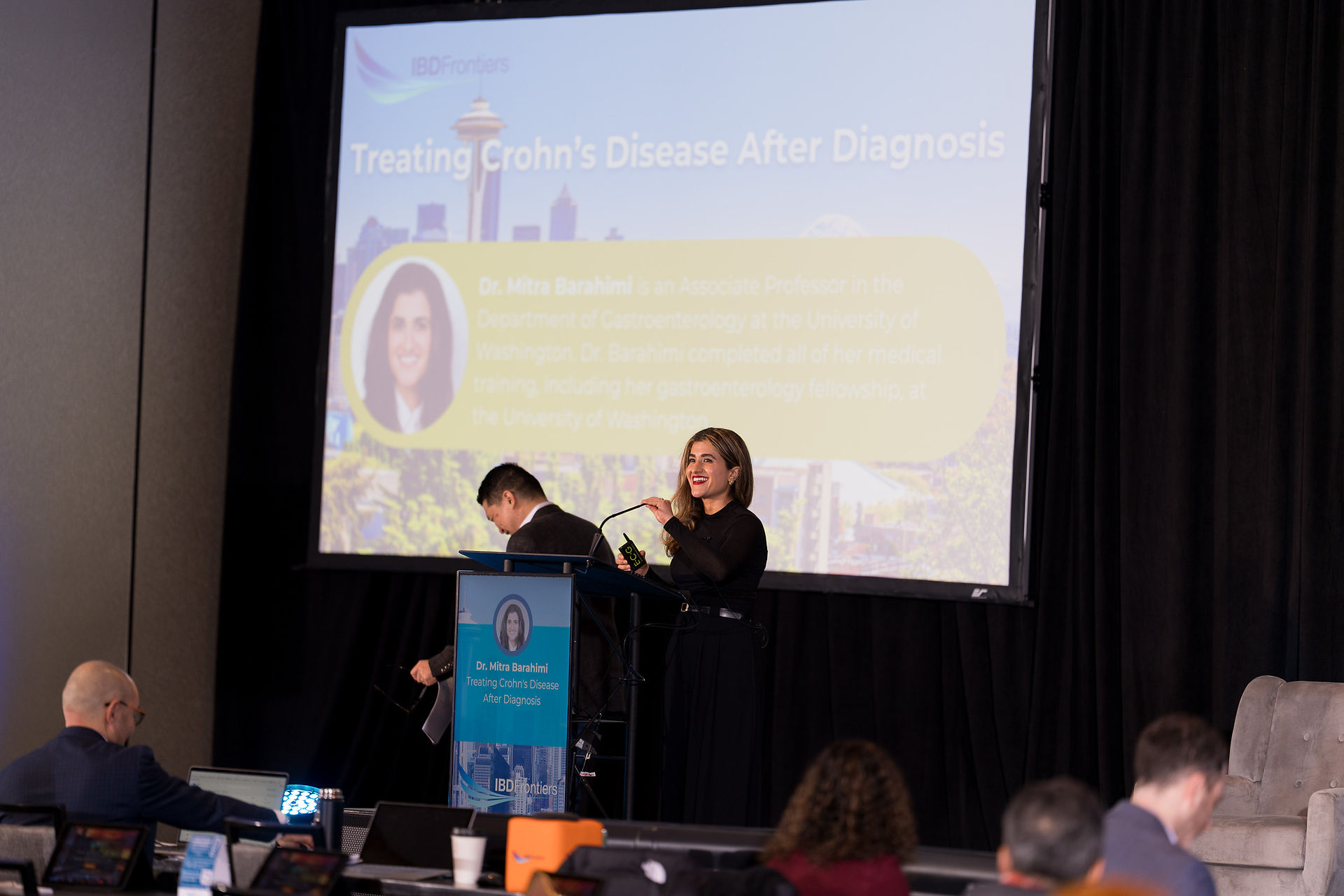 Speaker presents 'Treating Crohn's Disease' at Seattle symposium.